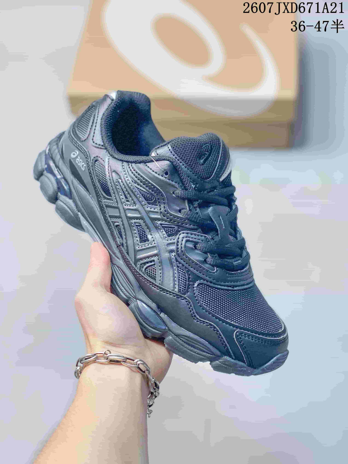 Dark gray and navy ASICS GEL-Kayano 14 sneaker shown from a front three-quarter angle.