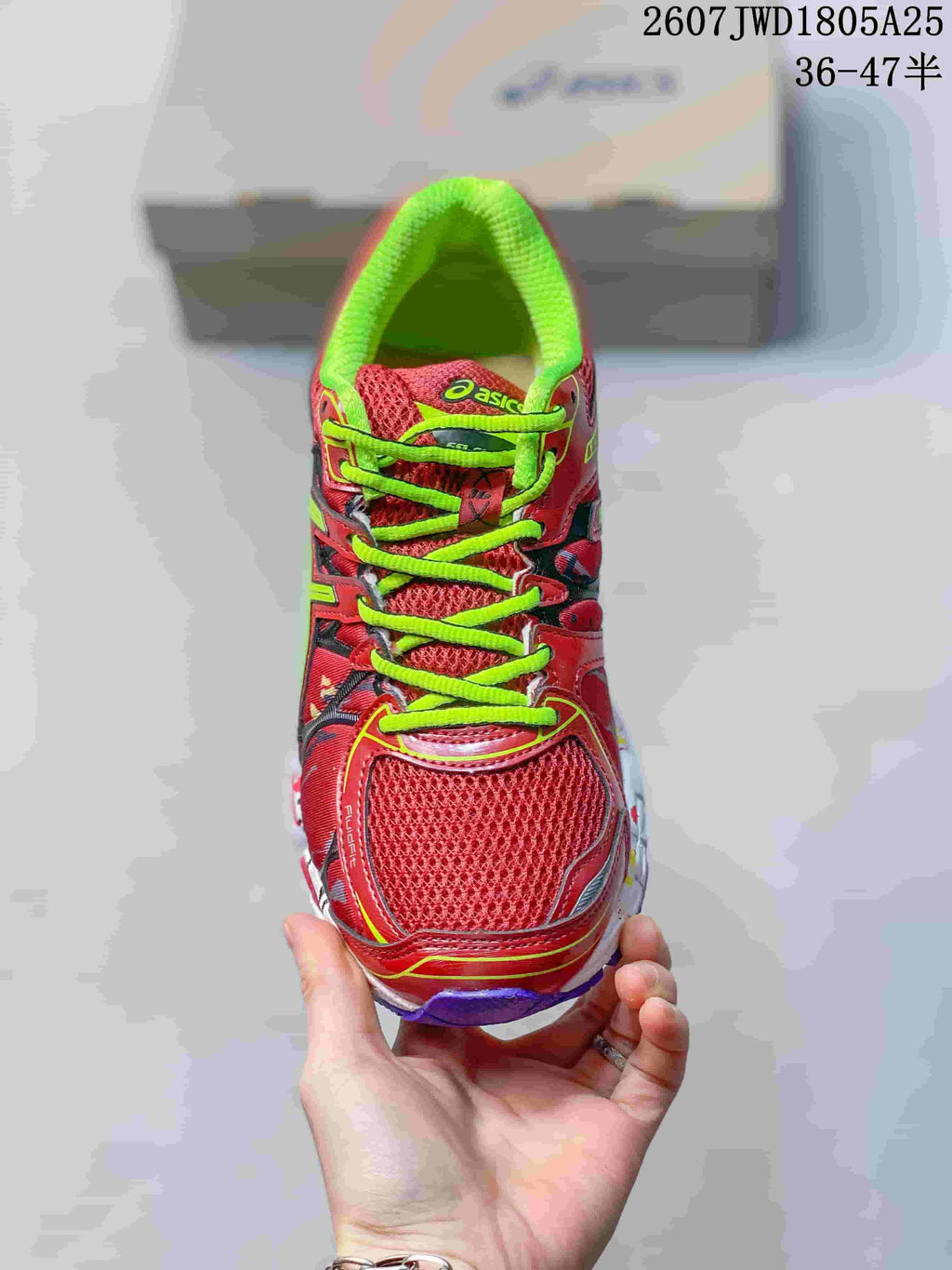 Top view showing the red mesh toe box, neon green laces and padded collar.