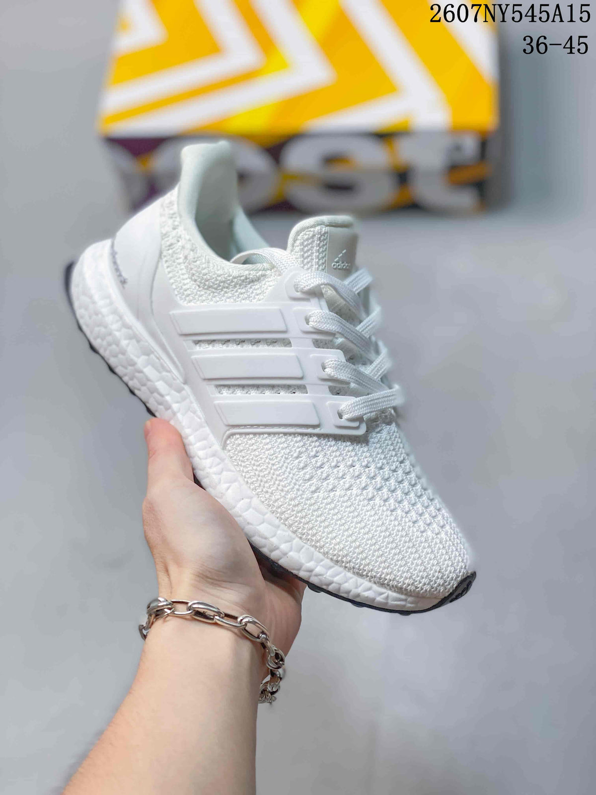 Angled side view of a white Adidas Ultraboost Light sneaker showing the knitted upper, side cage, heel structure and outsole edge.
