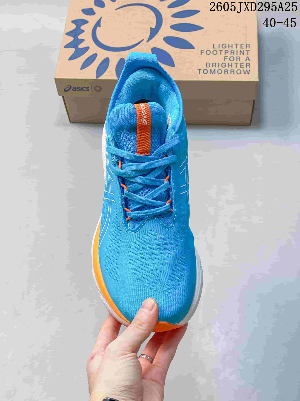 Top view of the blue ASICS running shoe showing its laces and padded tongue