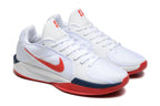 Angled view of white Nike Sabrina 1 basketball shoes with red Swoosh branding