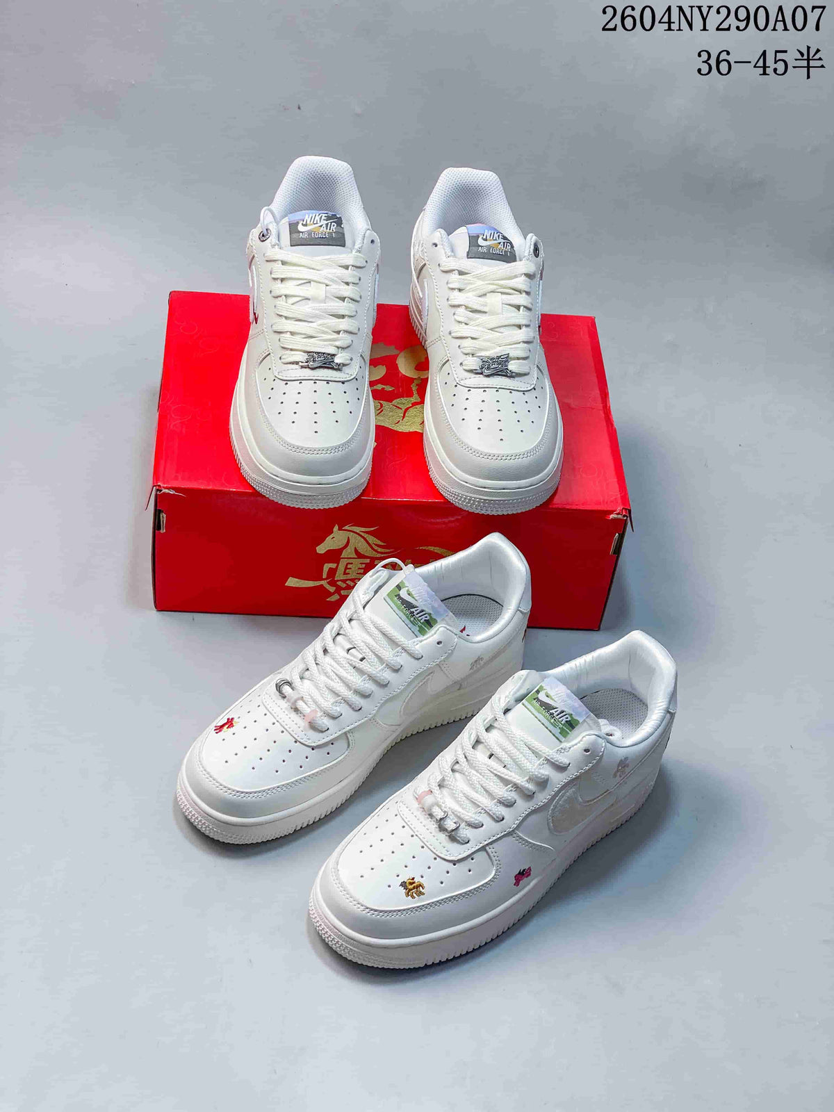 Several views of white low-top sneakers with decorative accents and a red presentation box