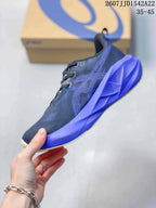 Side view showing the dark textile upper, layered side details and sculpted purple midsole.