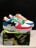 Pair of multicolor BAPE Bape Sta low-top sneakers displayed on a camouflage box.