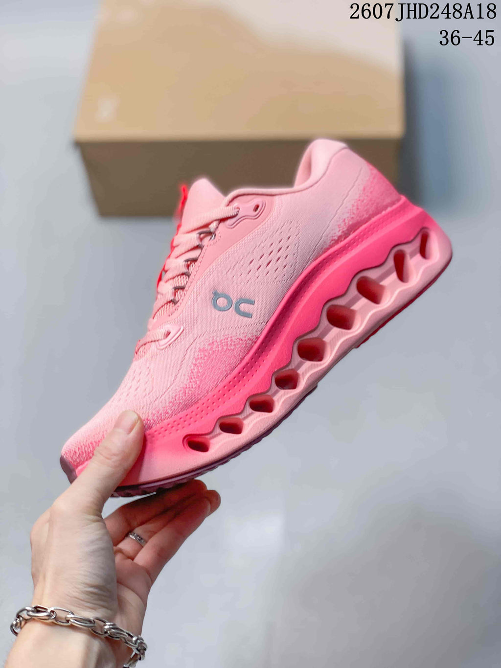 Side view of a pink On Cloudtilt sneaker showing the perforated upper, side logo, and sculpted outsole.
