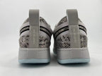 Rear view of both sneakers showing Chapter One heel tabs