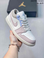 Angled side view showing the layered white and pink upper, light blue eyelet panel, padded collar and rubber outsole.