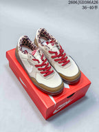 Pair of Nike Terra Manta Suede sneakers in cream, tan and red, displayed on a red shoe box; model code and size range are overlaid.