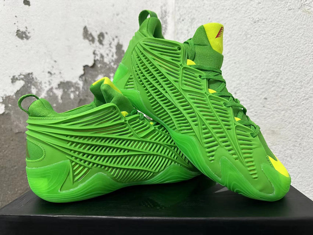 Green Adidas sneakers displayed together, showing side cage and yellow accents