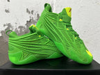 Green Adidas sneakers displayed together, showing side cage and yellow accents