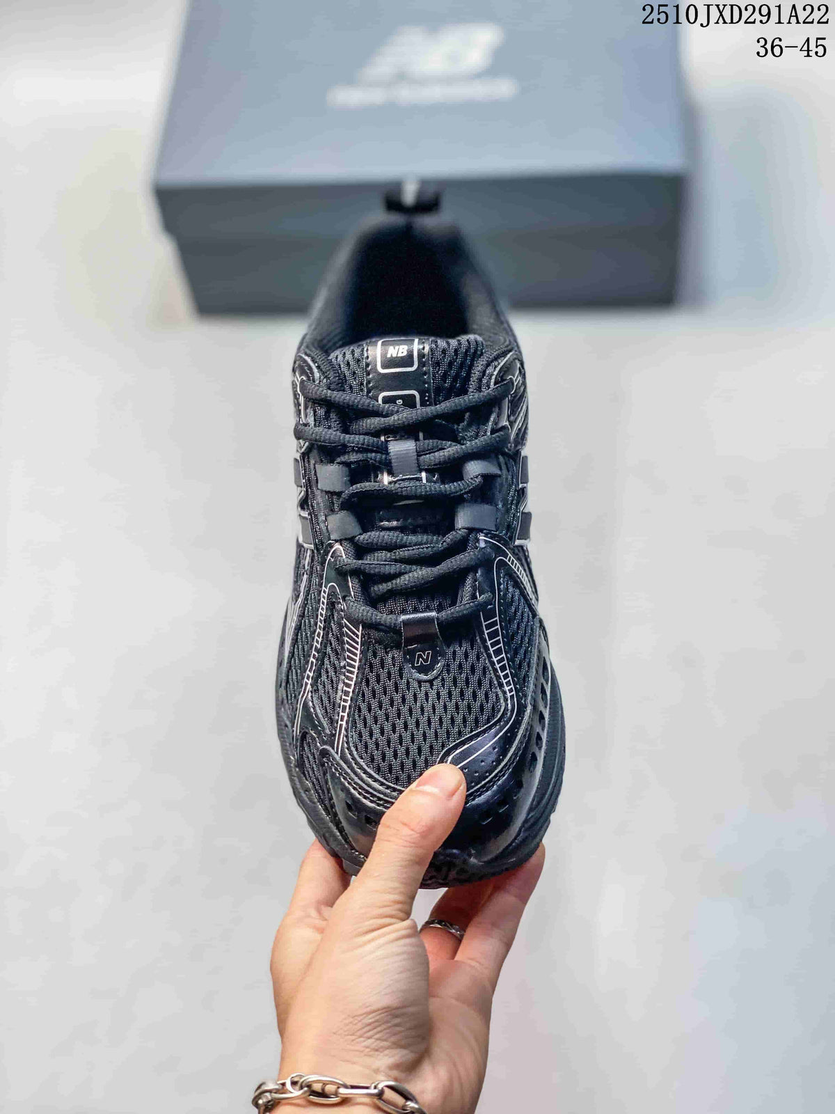 Top view of the mesh-look toe and lacing on a New Balance 1906AD sneaker