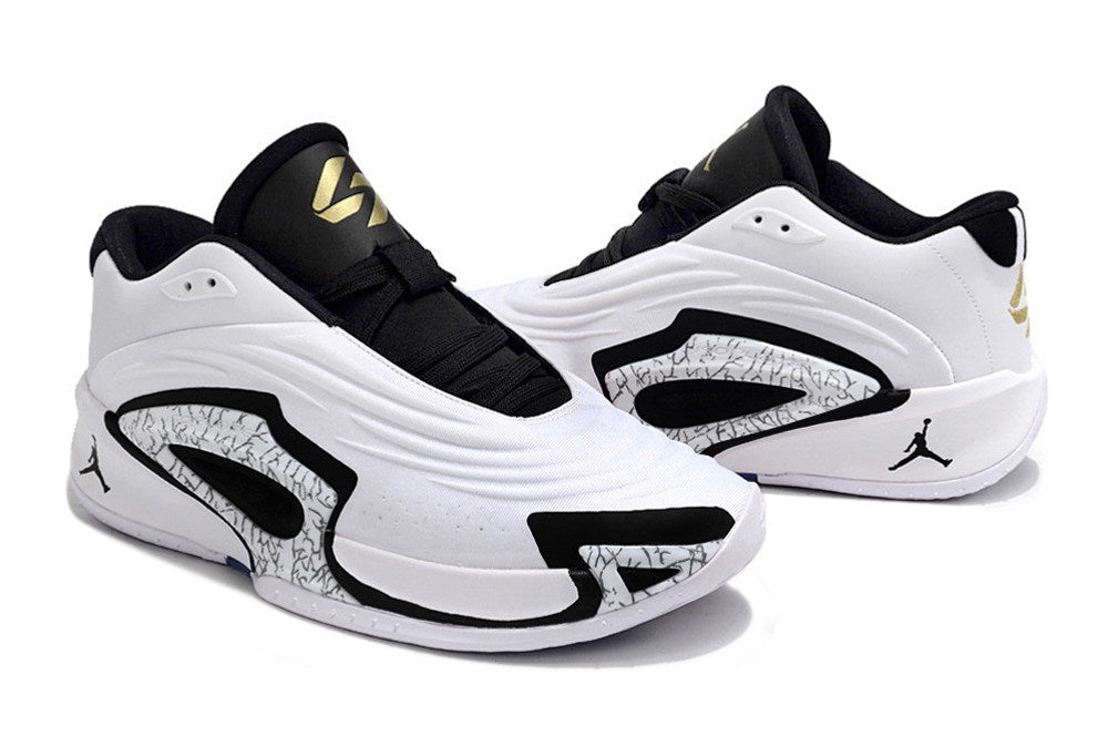 Pair of white Jordan Luka 3 shoes with black trim, gold details, and patterned side panels