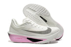 White Nike Zoom Fly 6 side profile with pink midsole and patterned outsole