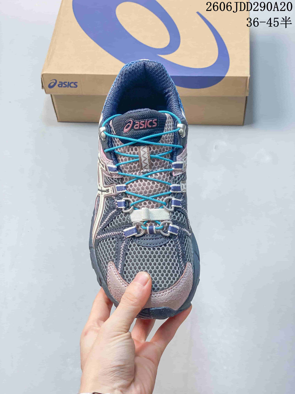 Top view showing the mesh toe box, bright blue laces and structured lace hardware.