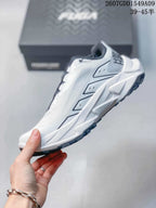 Side profile of the white Kailas shoe showing layered upper panels, geometric midsole shaping and dark outsole trim.