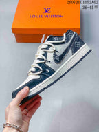 Side view of the low-top sneaker with white laces and patterned panels
