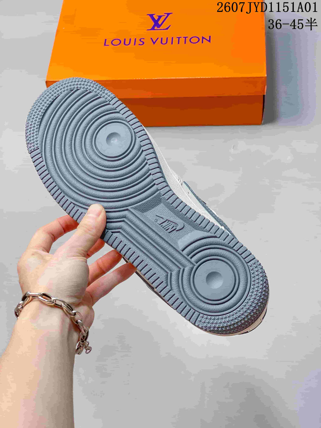Close-up of the gray sneaker outsole with circular tread patterns