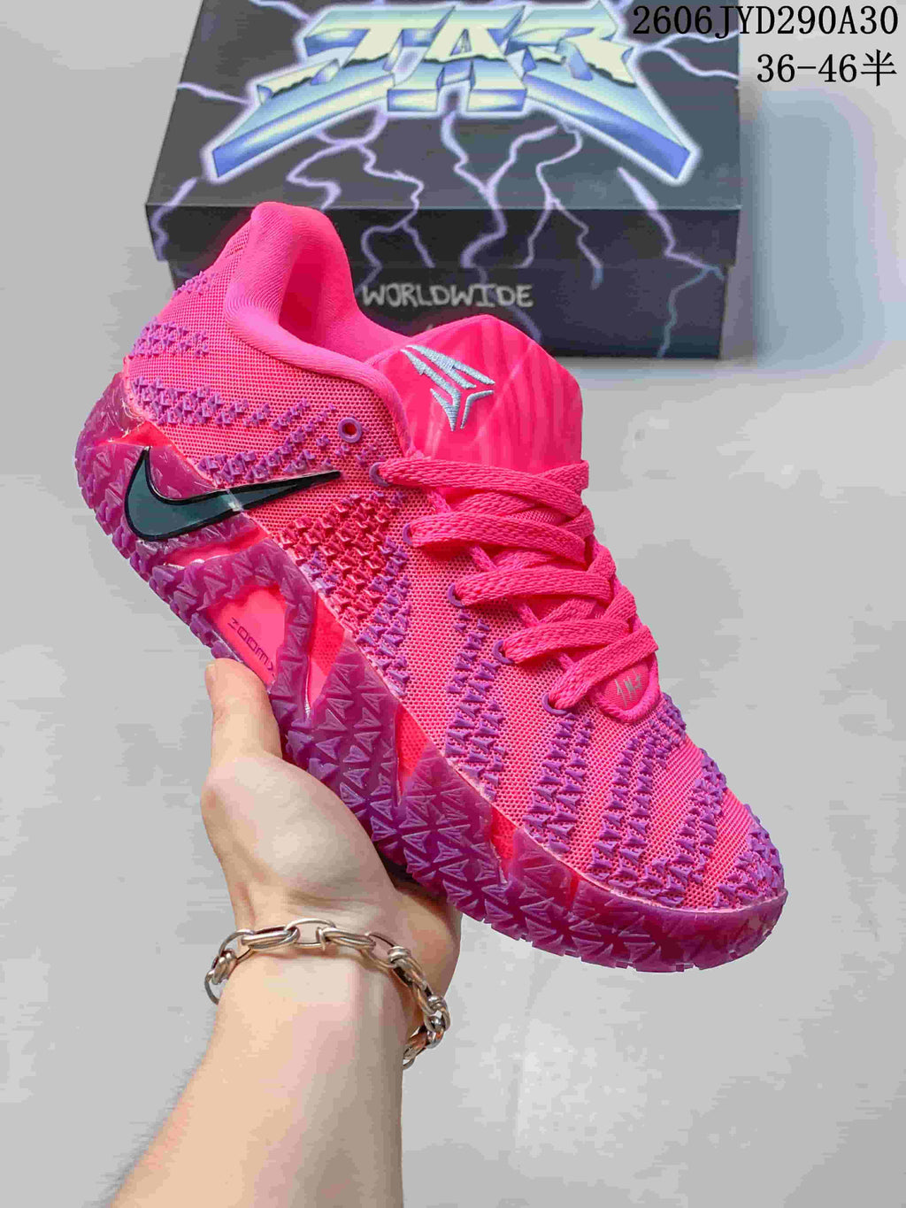 Bright pink Nike Ja 3 basketball shoe with dark accents