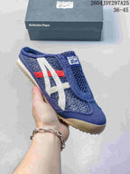 Navy Onitsuka Tiger Mexico 66 Sabot sneaker with white, red, and beige side stripes, shown with its box; the image shows style code 2604JDY297A25 and size range 36–45.