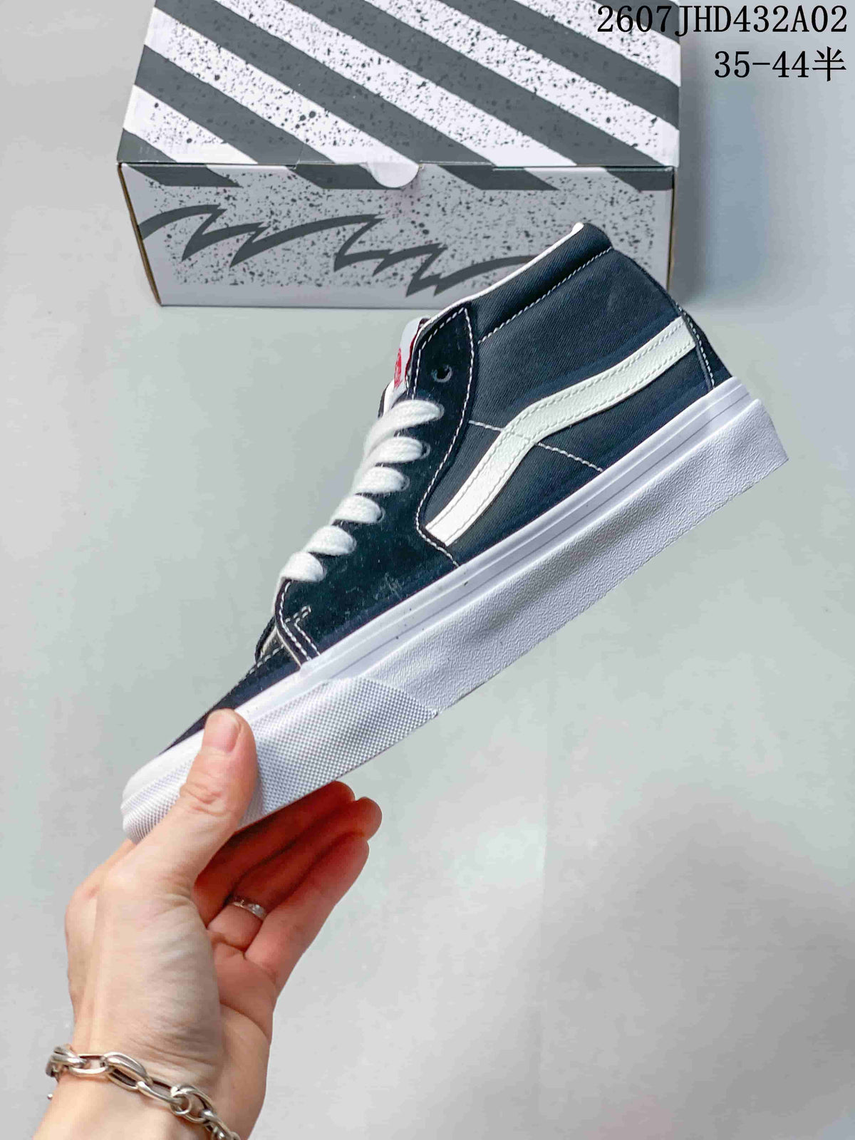 Side profile showing the white stripe and mid-top shape