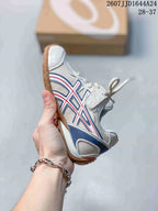 Side view showing the layered ASICS branding, mesh panels and lace-up construction.