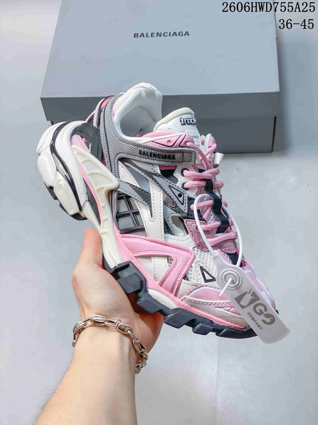 Angled side view of a white, pink, and gray Balenciaga Track 2 sneaker; an image overlay shows a 36–45 size range.