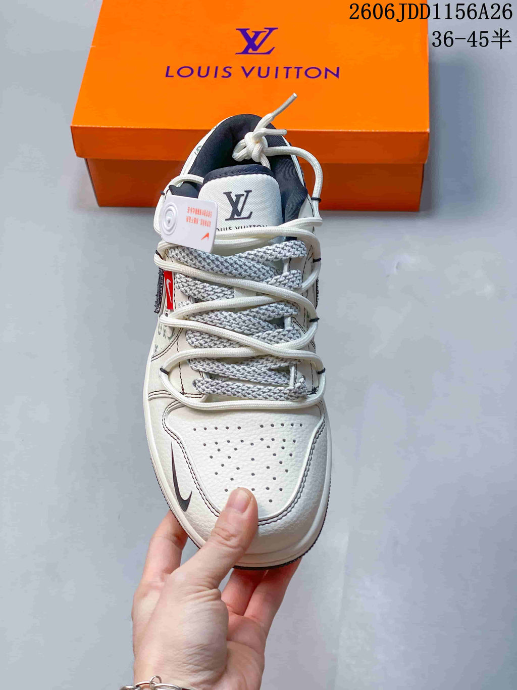 Top view showing the perforated toe, layered rope laces, patterned panels, and branded tongue.