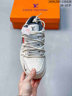 Top view showing the perforated toe, layered rope laces, patterned panels, and branded tongue.