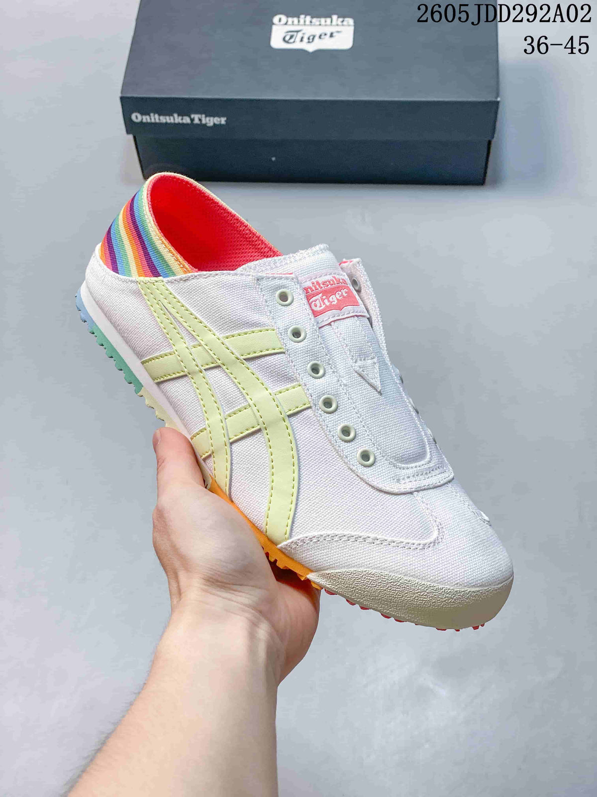 White Onitsuka Tiger slip-on sneaker with pale yellow stripes and a multicolor heel