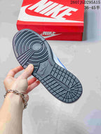 Underside view showing the black rubber outsole with circular forefoot and heel traction patterns.