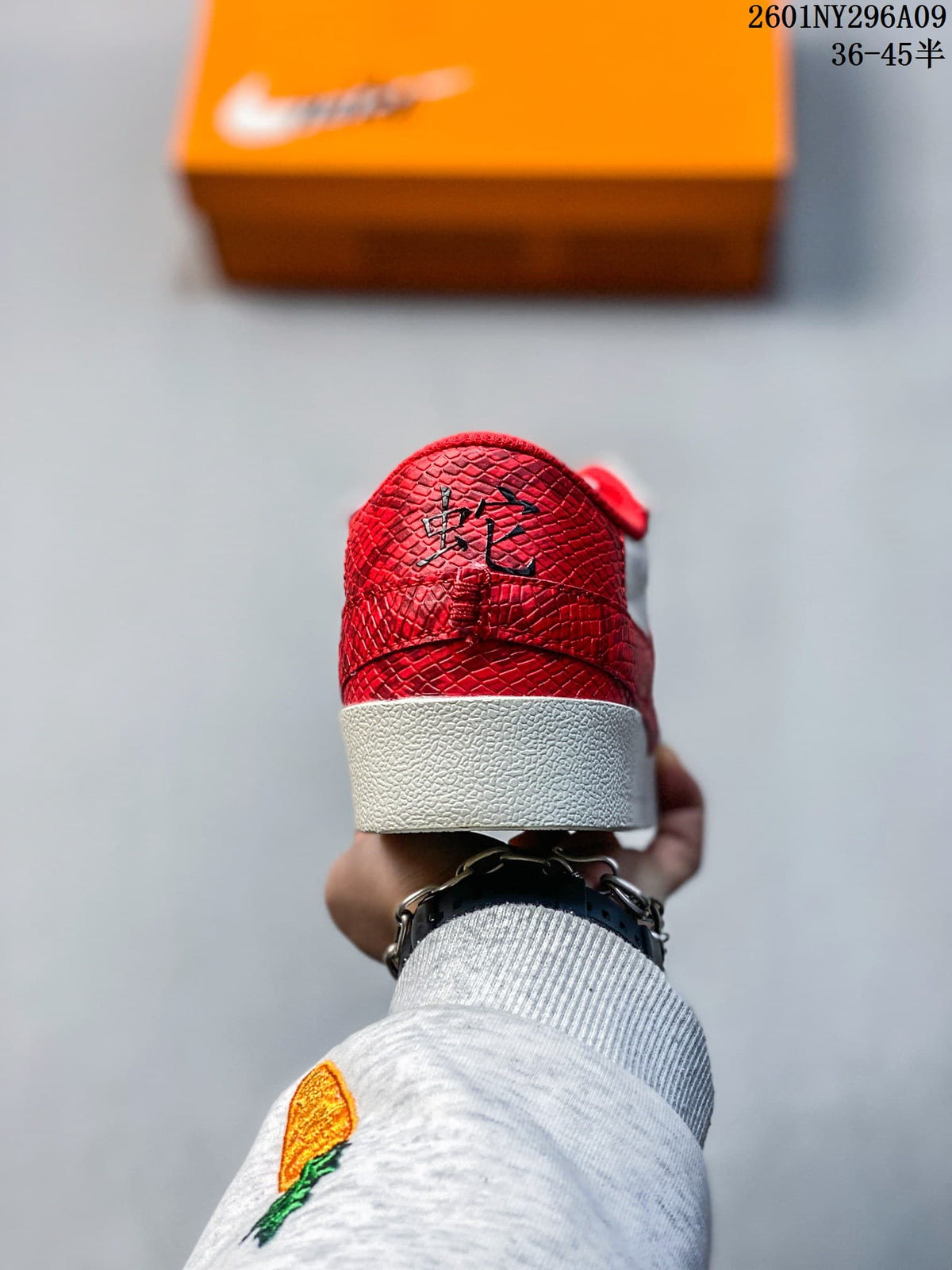 Rear view showing the red textured heel overlay and white rubber midsole.