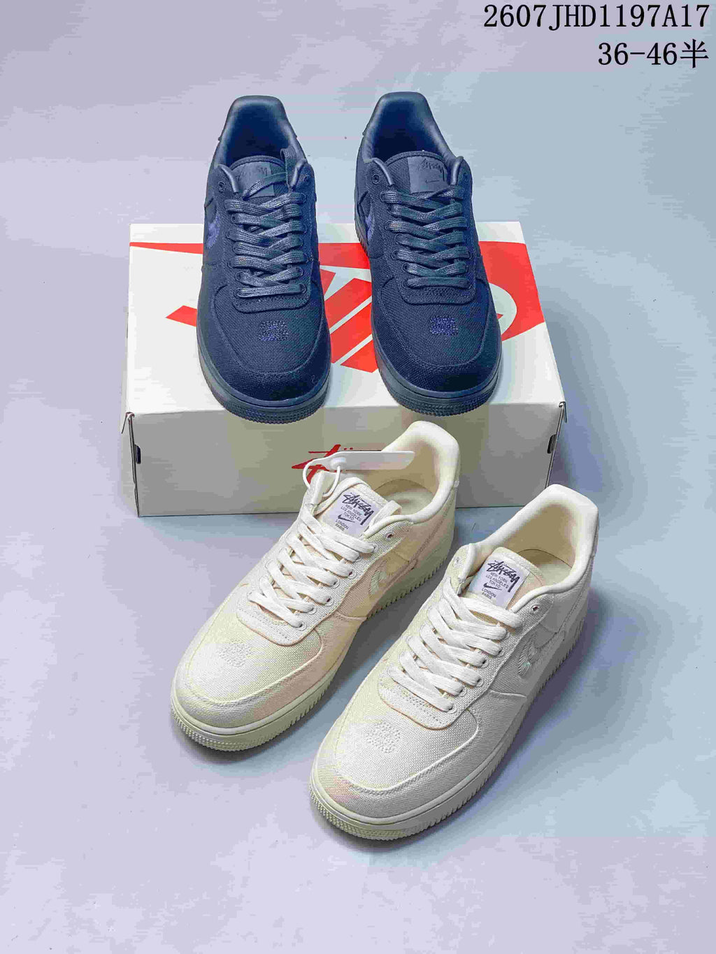 Black and cream Nike Air Force 1 '07 x Stussy sneakers shown together from front and side angles.