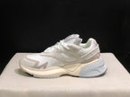 Side profile showing the mesh-style sections, layered panels and sculpted outsole.