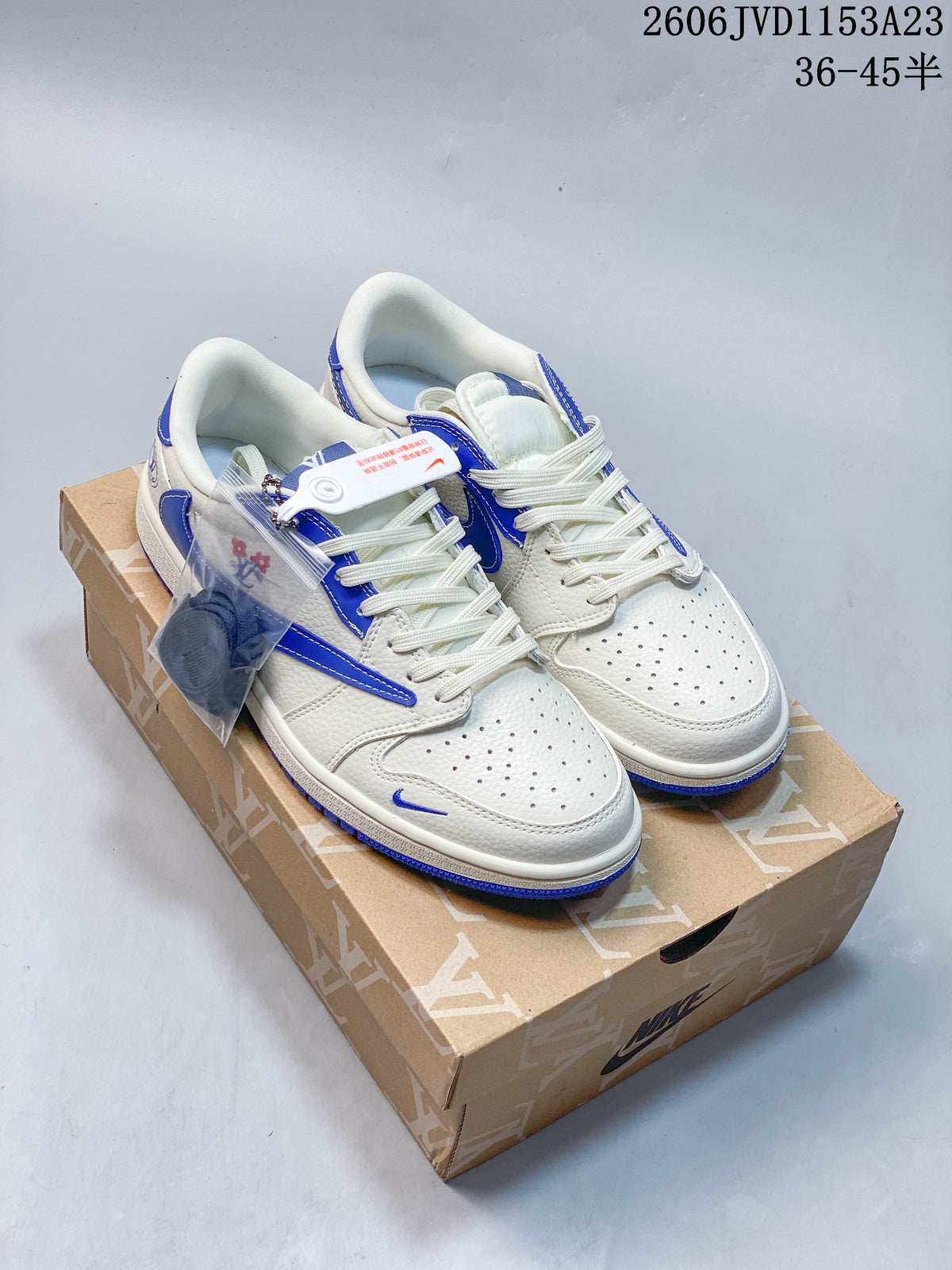Pair of off-white and blue low-top sneakers displayed on a patterned box
