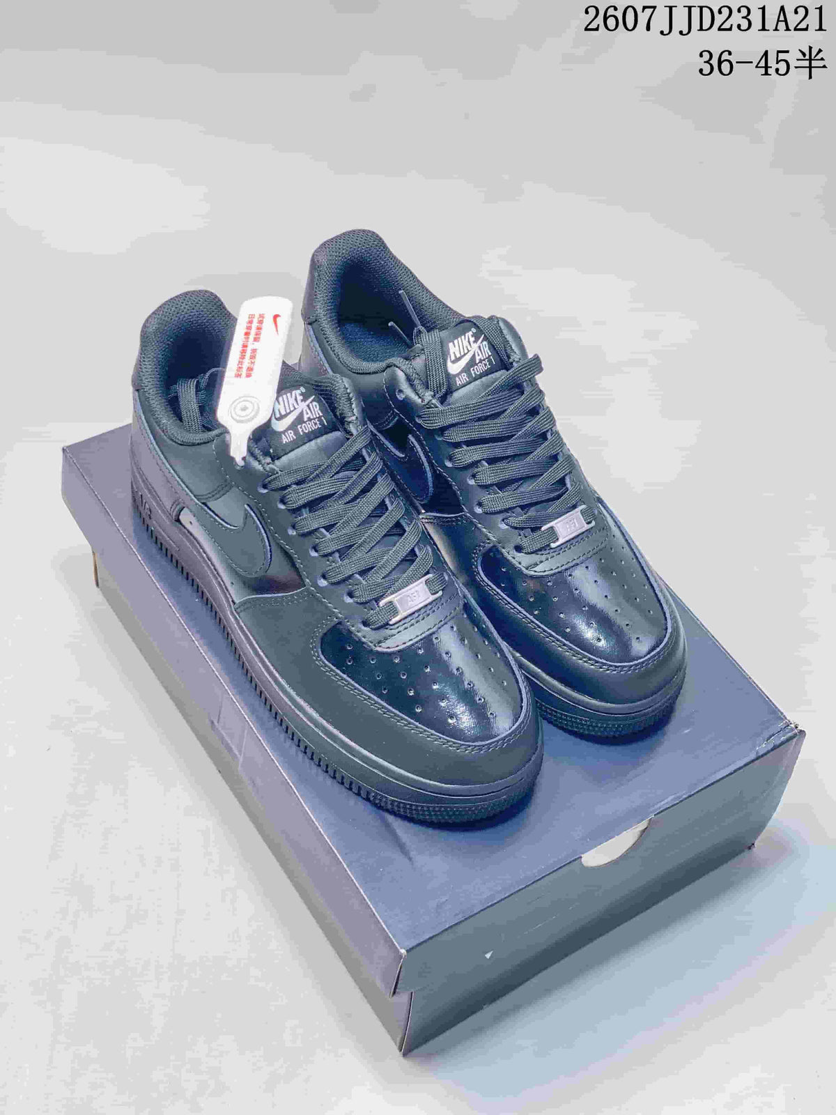 Pair of black Nike Air Force 1 low-top sneakers displayed on a shoe box.