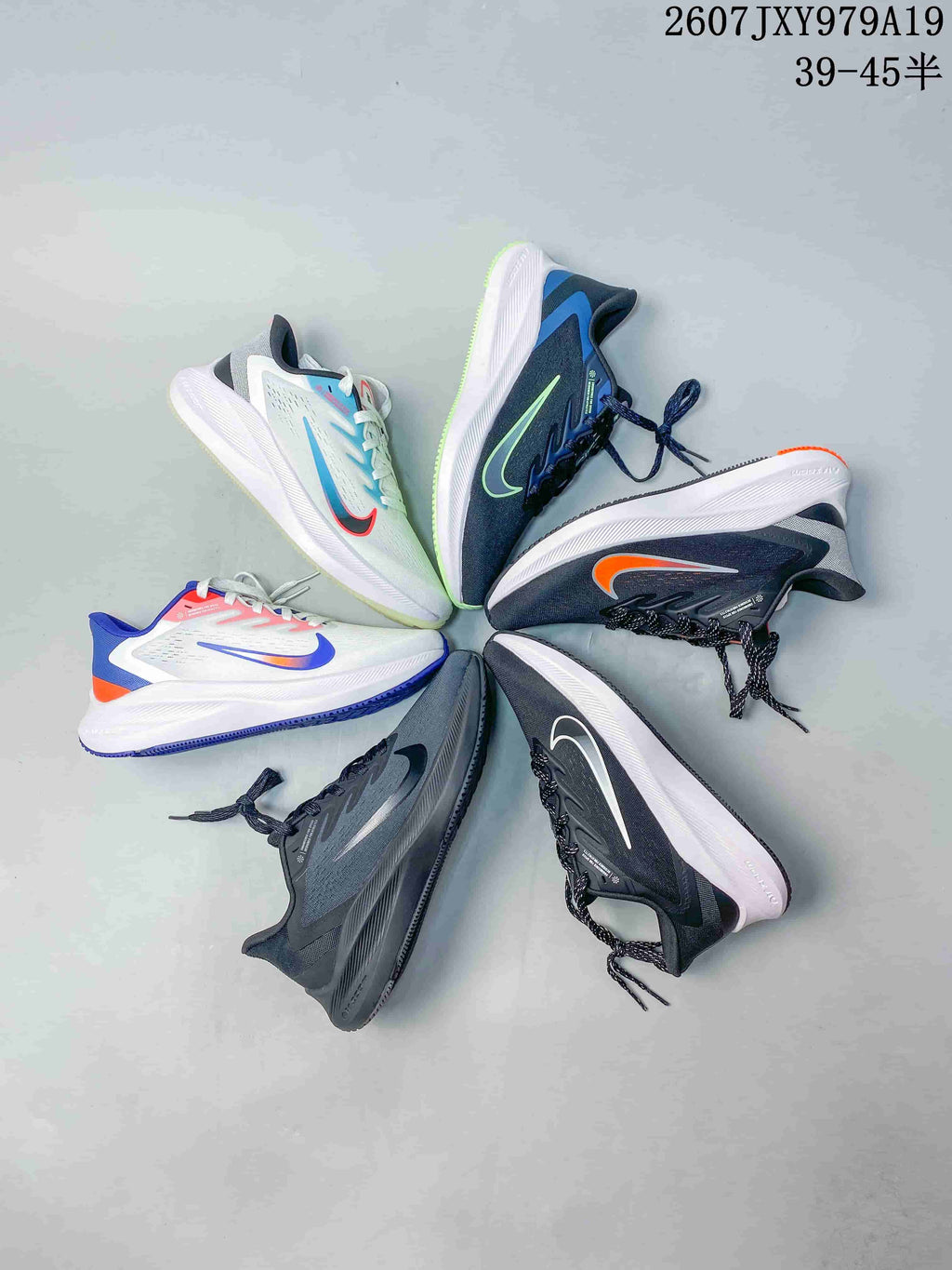 Flat lay showing six Nike running sneakers in different colorways arranged in a circular layout.