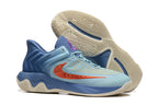 Blue basketball shoes showing the patterned cream outsole and side profile