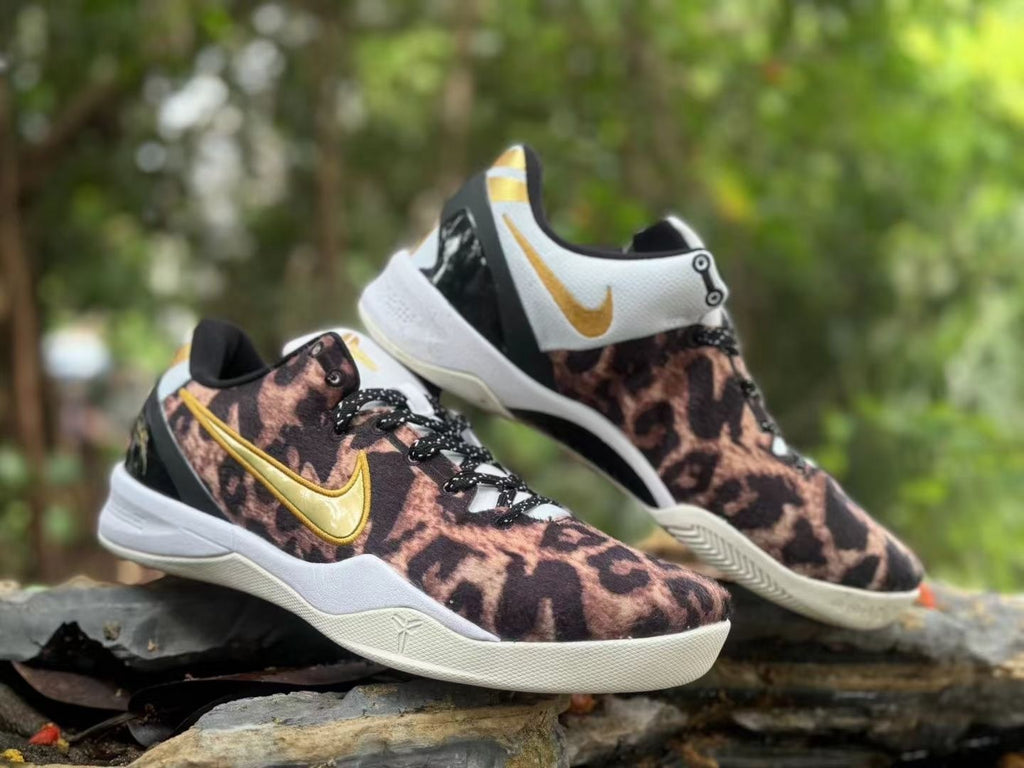 Angled pair view of leopard-print Nike Kobe 8 shoes with gold Swooshes