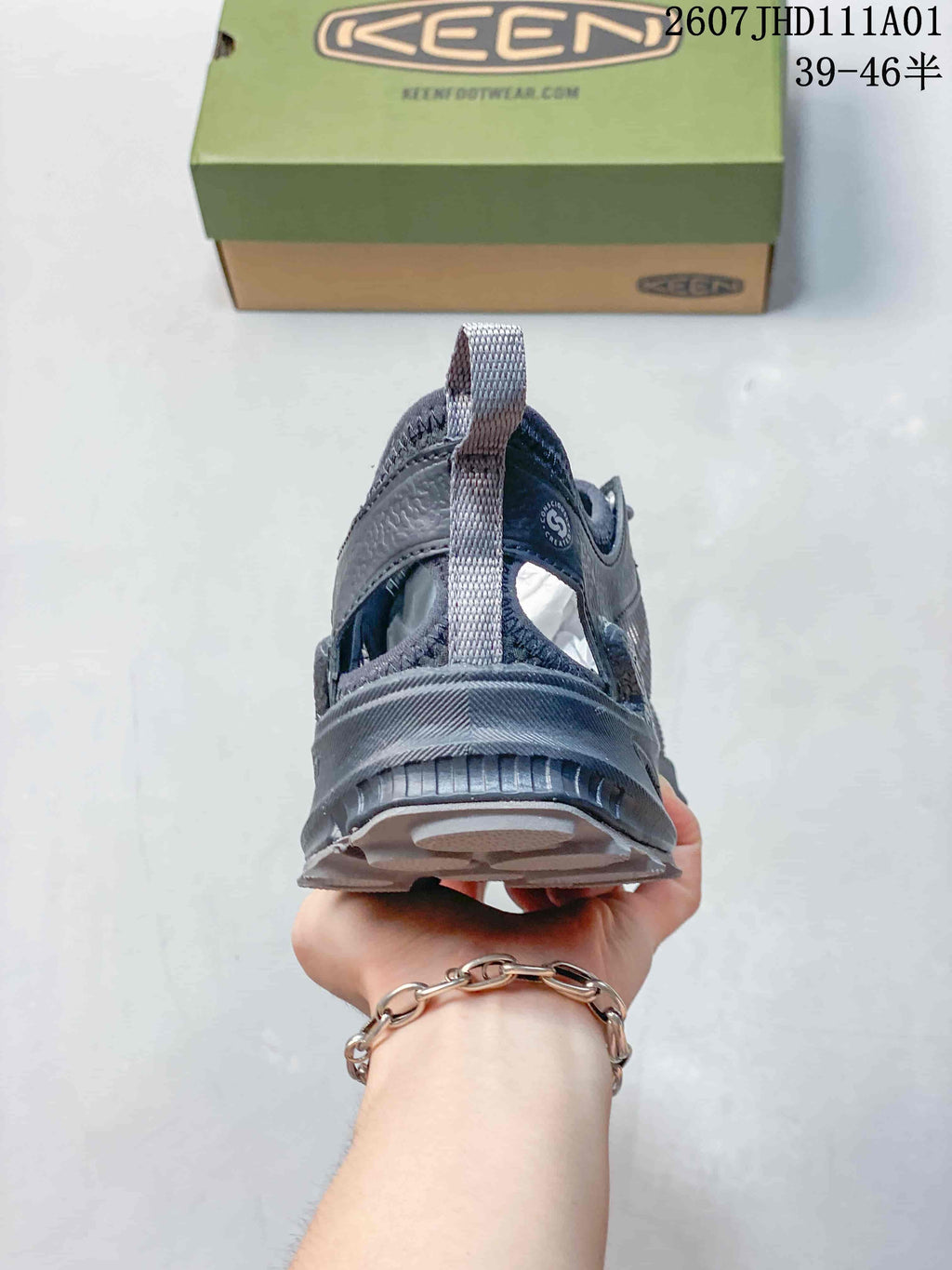 Rear view of a gray Keen Zionic ADV shoe showing its heel pull loop
