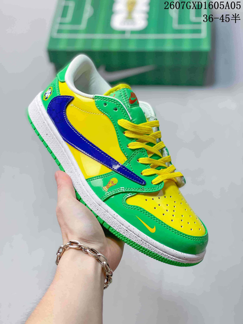Angled side view highlighting the green and yellow upper, blue Swoosh and green outsole.