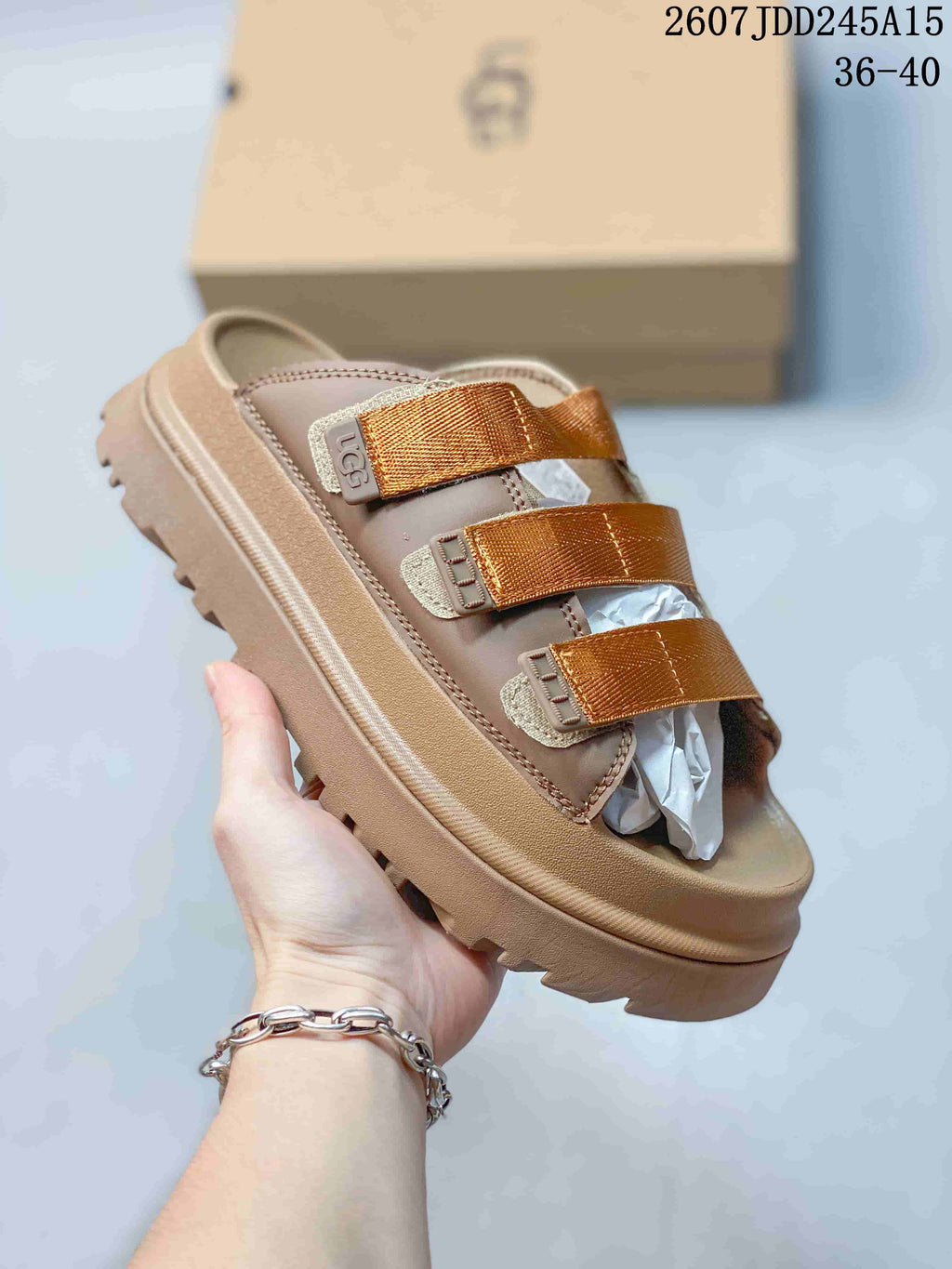 Angled view of the tan platform sandal showing the open toe, three straps, and textured outsole.