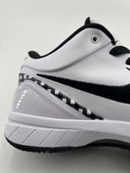 Close-up of the white shoe heel, black Swoosh, and checkerboard trim