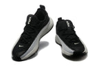 Black and light gray Nike LeBron TR1 low-top basketball shoes, front view