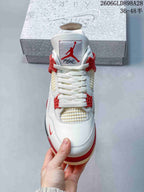 Front view showing the laces, mesh panels, and red accents.