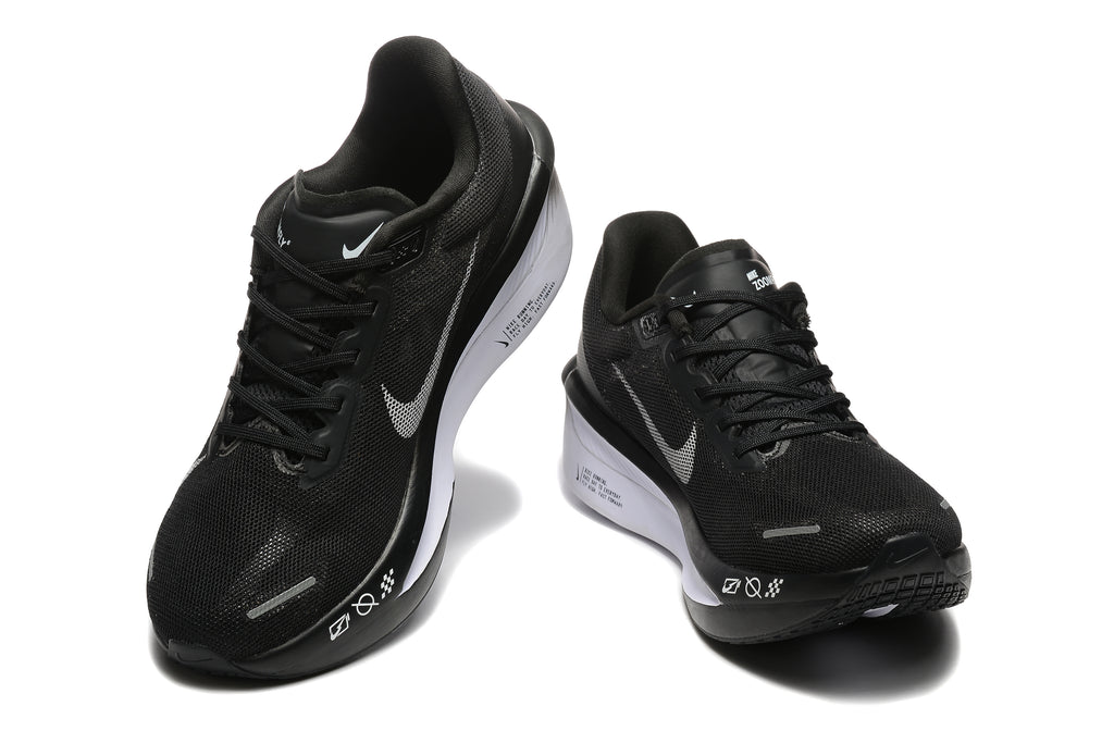 Black Nike Zoom Fly 6 shoes with light-colored swooshes, viewed from the front