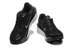 Black Nike Zoom Fly 6 shoes with light-colored swooshes, viewed from the front