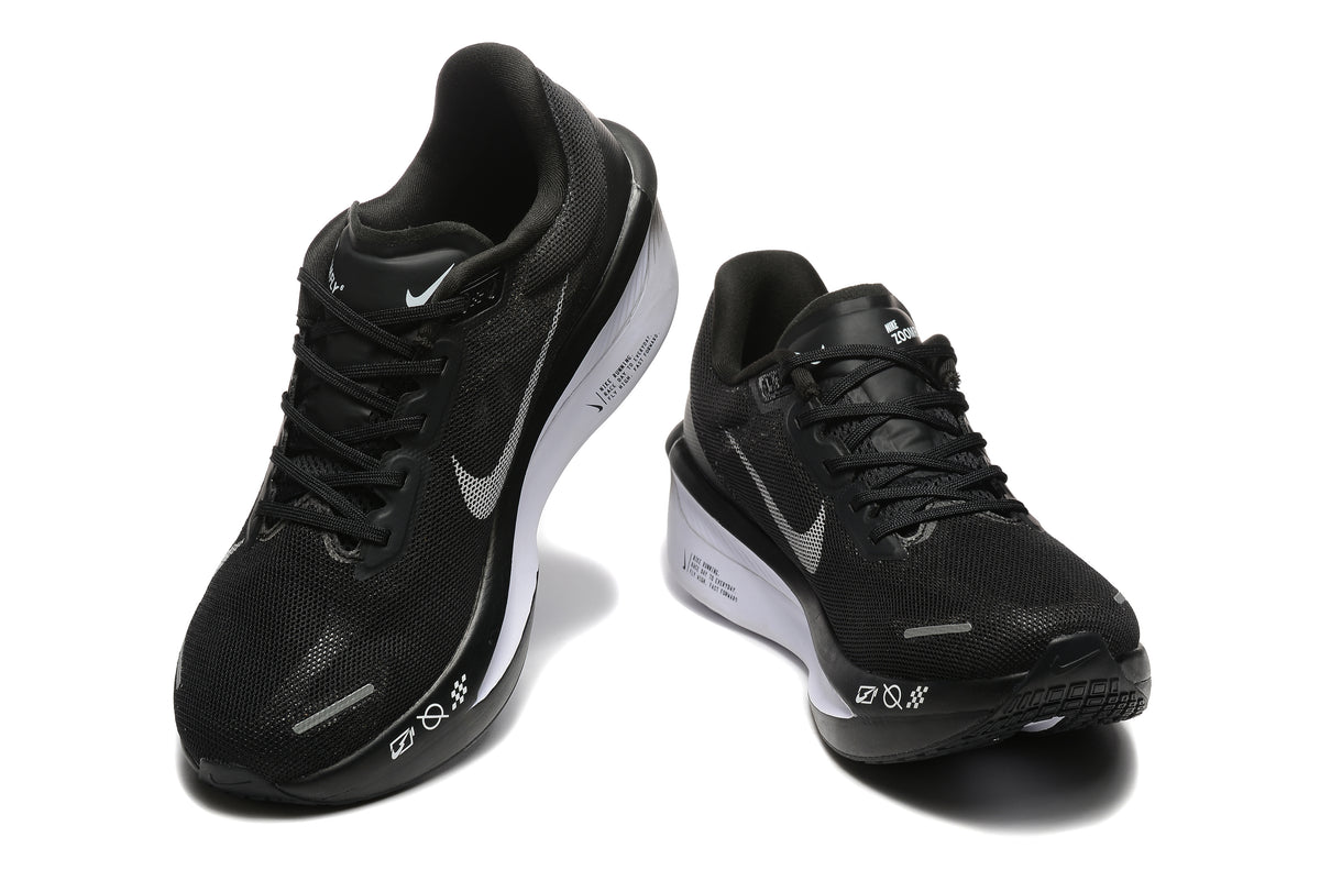 Black Nike Zoom Fly 6 shoes with light-colored swooshes, viewed from the front