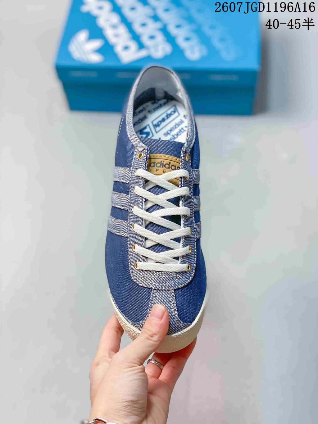 Top view showing the white laces, metallic eyelets, tongue branding, and stitched toe panel.