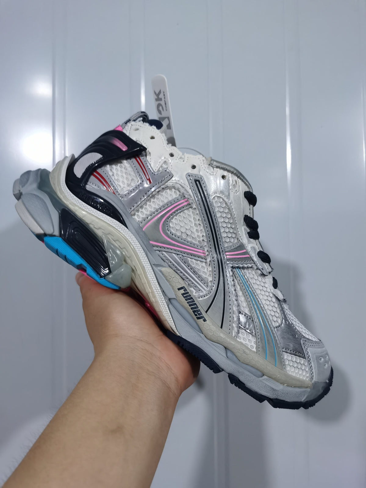 Close angled view of the Balenciaga Runner sneaker showing the side branding, contrasting panels and sculpted multi-tone sole.
