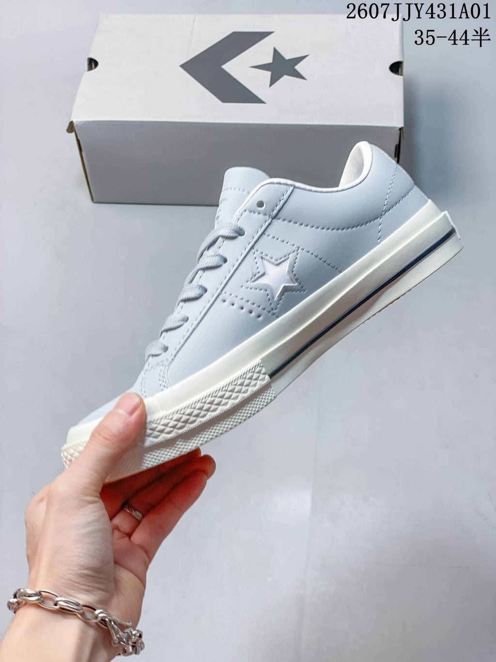 Side profile showing the tonal star detail and off-white sole